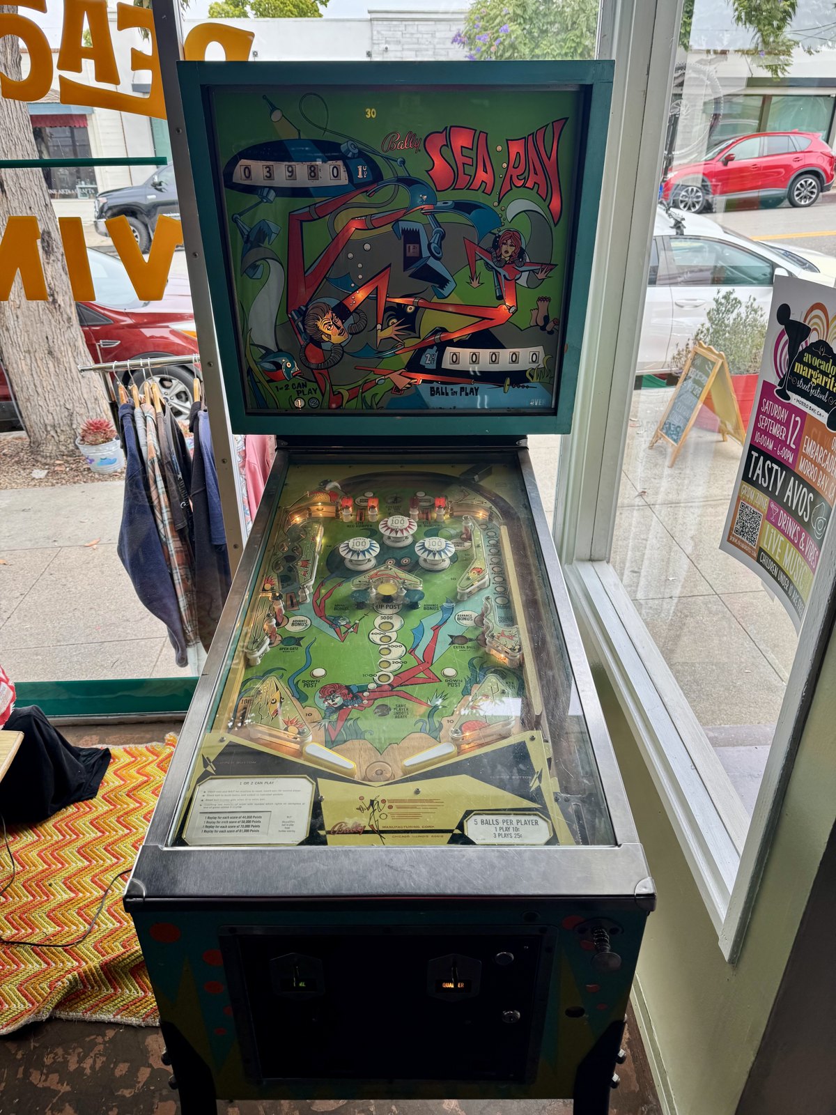 Vintage pinball machine near the front window at Beachcomber Vintage.