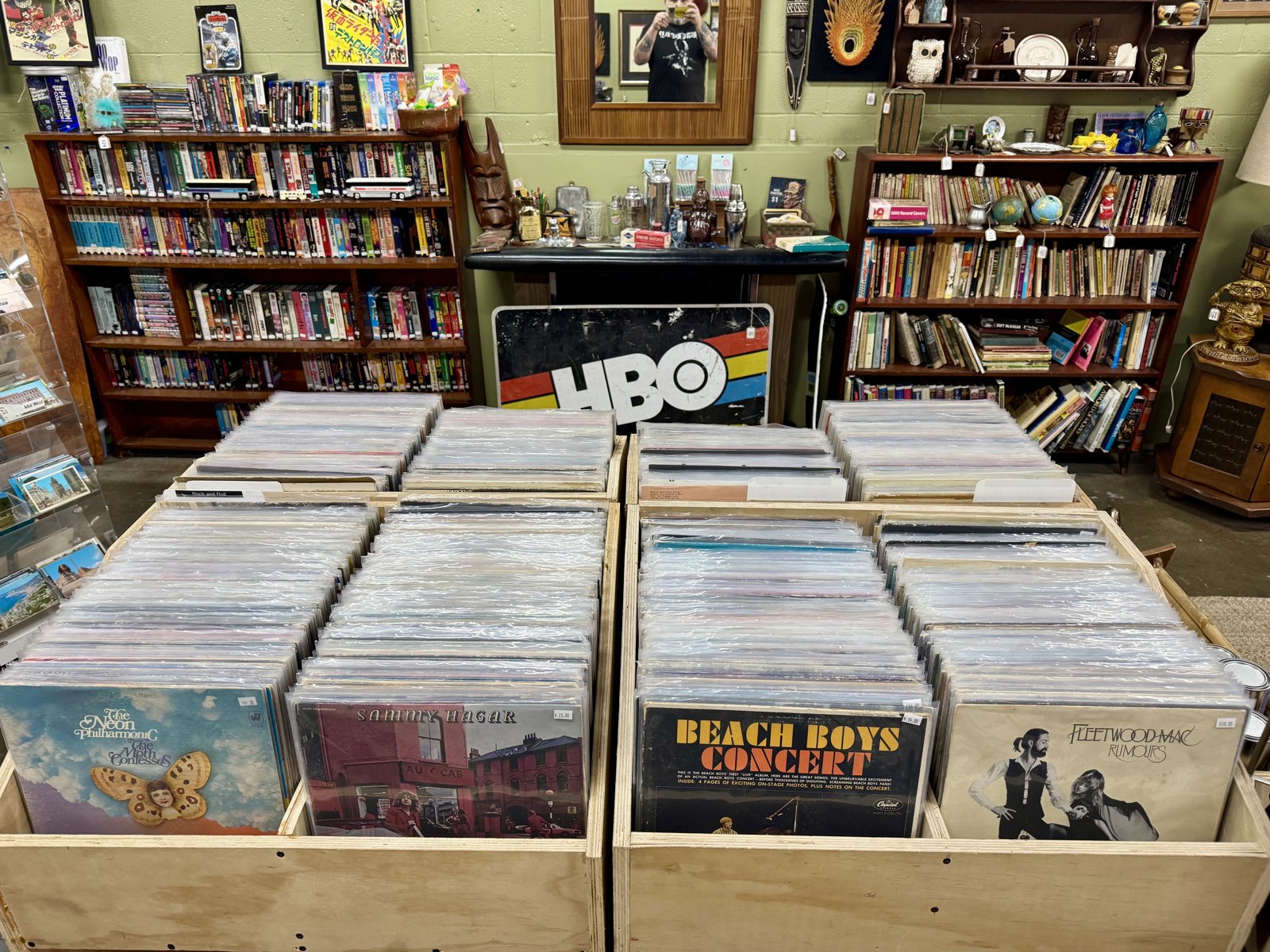 Vinyl bins in front of books and curios inside Beachcomber Vintage.